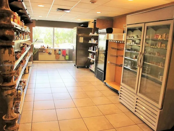 a kitchen with lots of bottles of alcohol