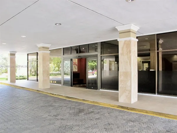 a view of an empty room with glass door