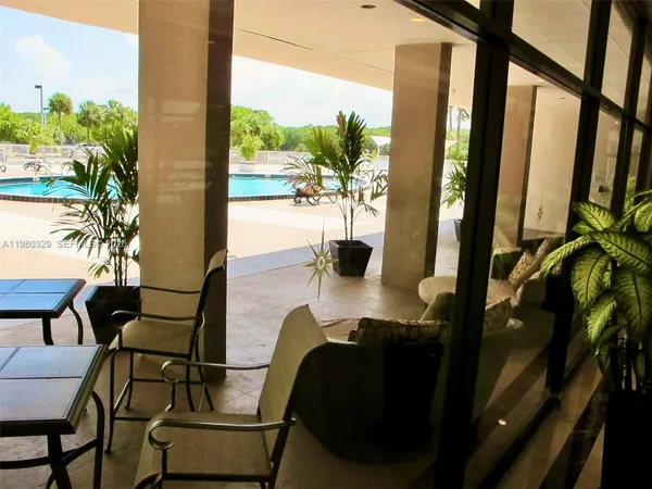 a view of swimming pool with a lake view