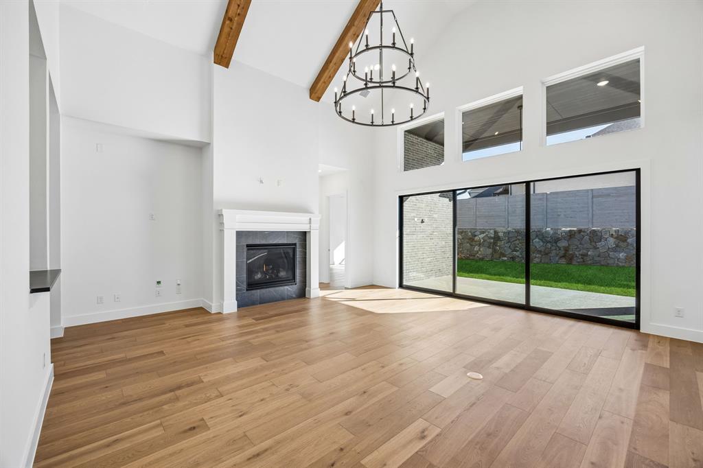 2404 Cairn Road McKinney, TX 75071 - Photo 7 of 18 Featuring a family room with a full wall slider, you'll enjoy effortless indoor-outdoor entertaining spaces in this over the top home!