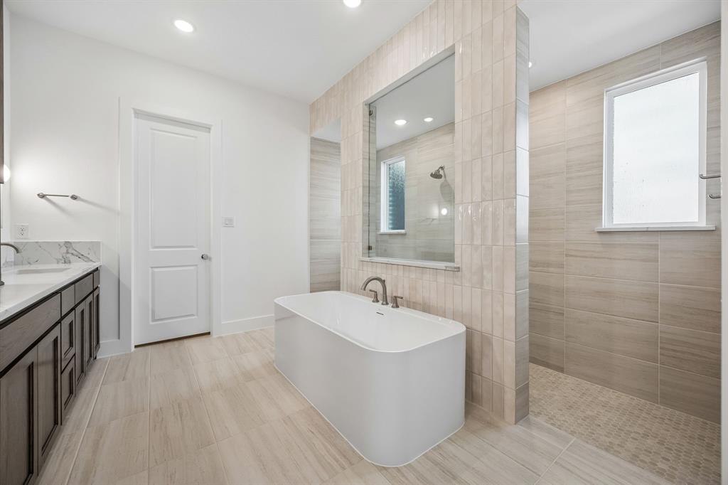 2404 Cairn Road McKinney, TX 75071 - Photo 16 of 18 The Madison II floor plan features our signature owner's bath with free standing tub, double walk through shower and drying areas!