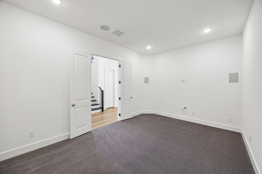 2404 Cairn Road McKinney, TX 75071 - Photo 4 of 18 Whether hosting family movie night or the big game day party, this wonderful main floor media room is the place to be!