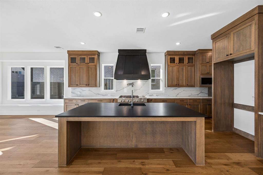 2404 Cairn Road McKinney, TX 75071 - Photo 13 of 18 Our Madison II floor plan offers a dream kitchen with tons of space and style!