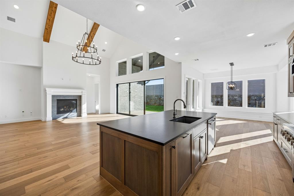 2404 Cairn Road McKinney, TX 75071 - Photo 14 of 18 Featuring a chef's dream kitchen that is open to the family and dining rooms, entertaining is a breeze in our Madison II floor plan.