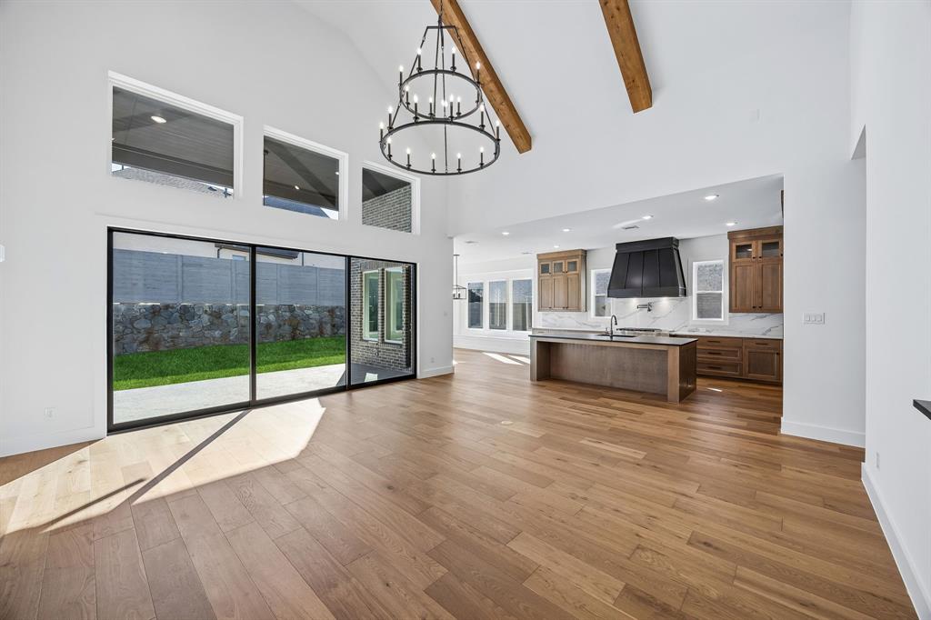 2404 Cairn Road McKinney, TX 75071 - Photo 15 of 18 Our Madison II floor plan offers a family room spacious enough to host the entire family.