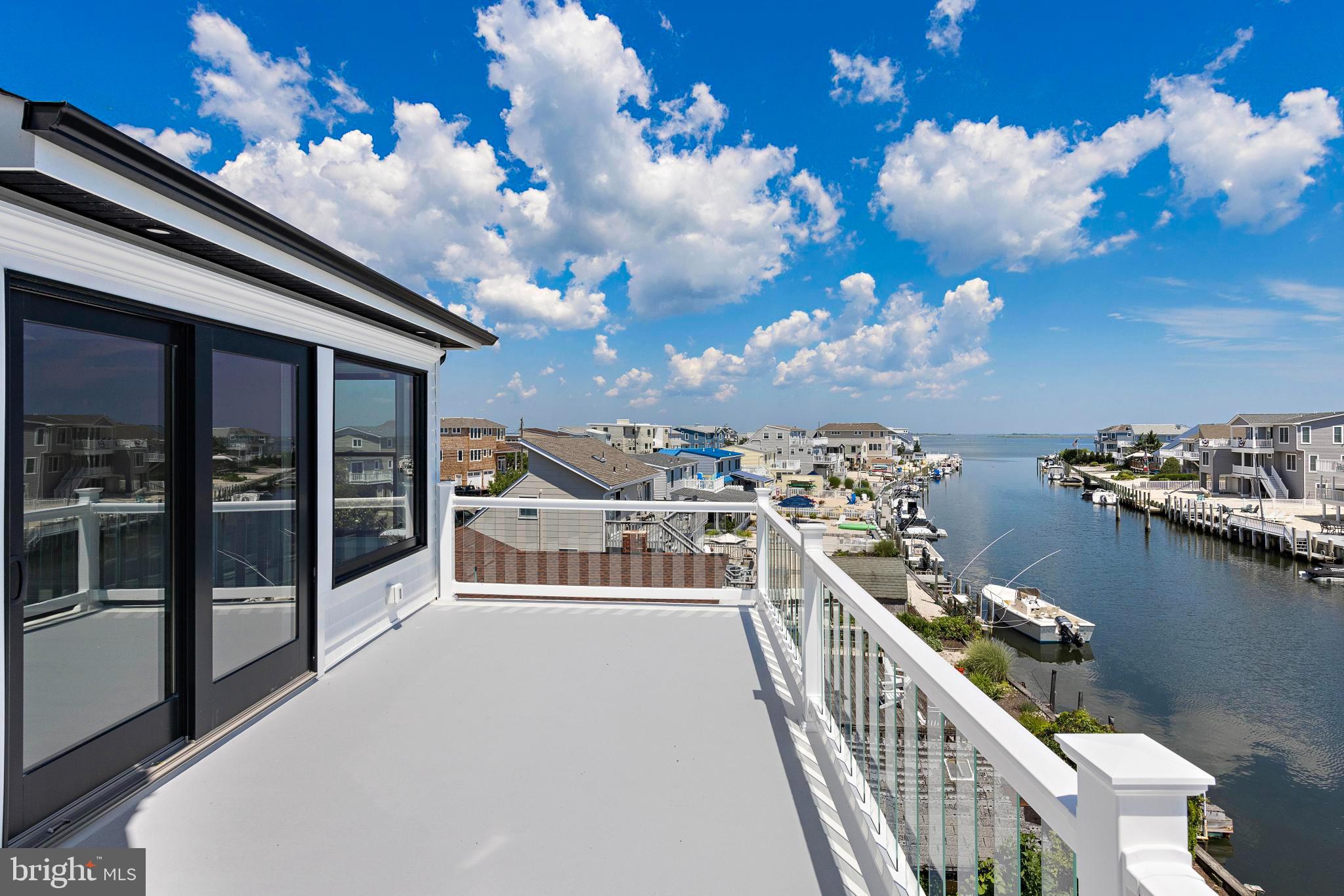 17 Butler Road Long Beach Township, NJ 08006 - Photo 102 of 110 a view of a balcony with chairs