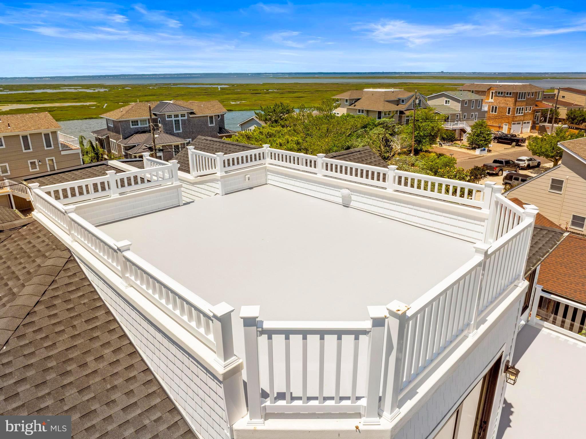 17 Butler Road Long Beach Township, NJ 08006 - Photo 108 of 110 a view of a balcony with an ocean