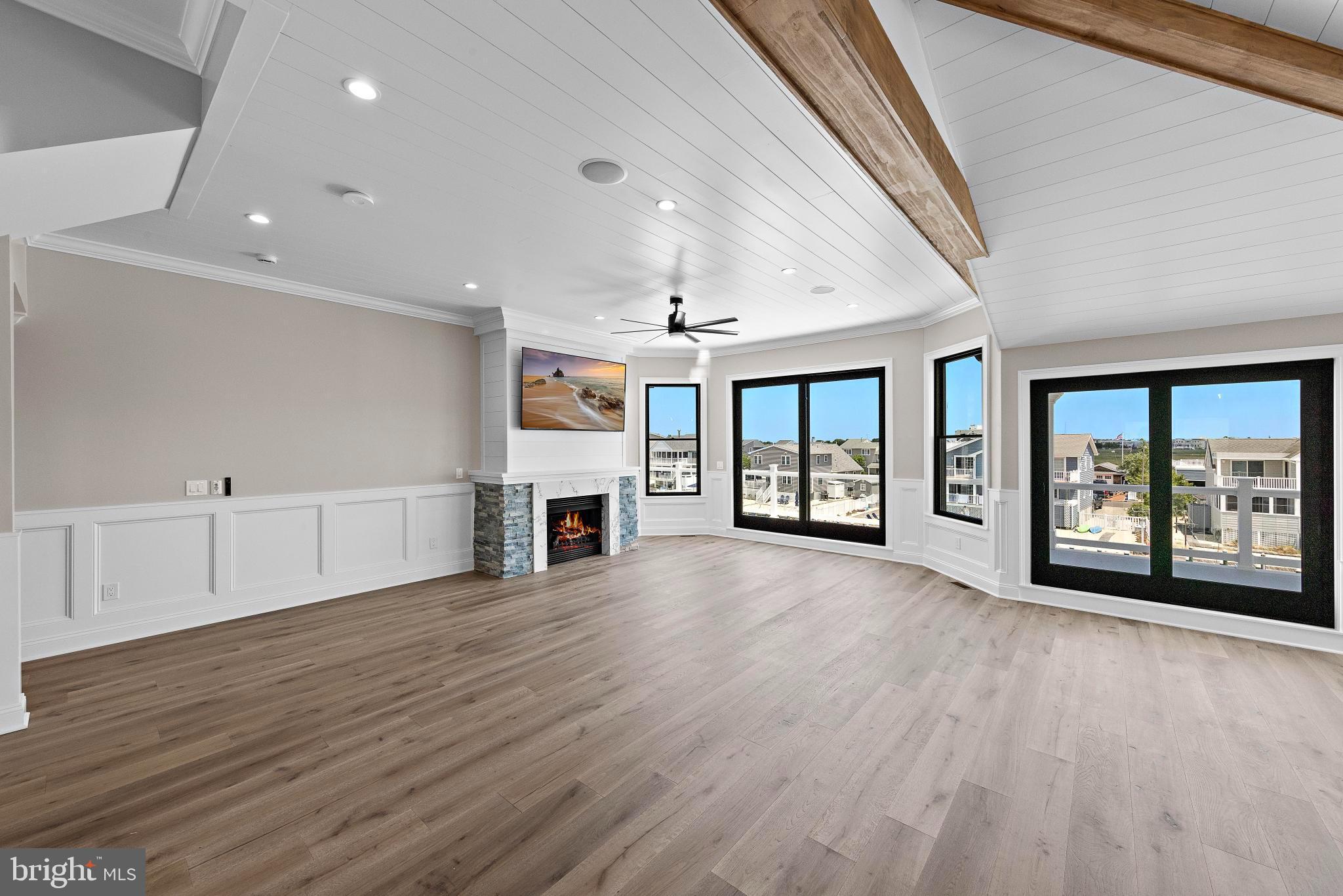 17 Butler Road Long Beach Township, NJ 08006 - Photo 11 of 110 a view of an empty room with wooden floor and a window