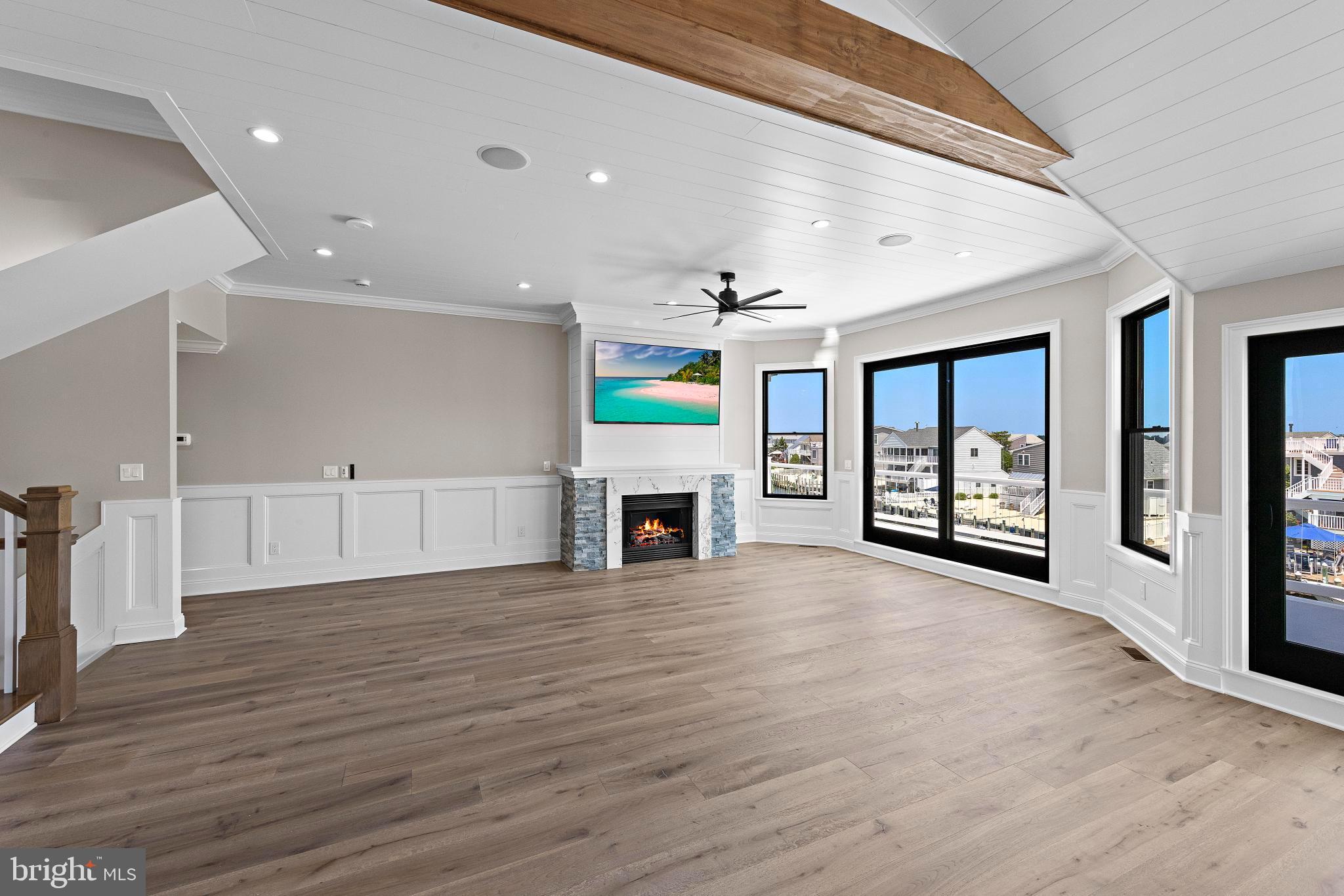 17 Butler Road Long Beach Township, NJ 08006 - Photo 12 of 110 a view of an empty room with a fireplace and a window