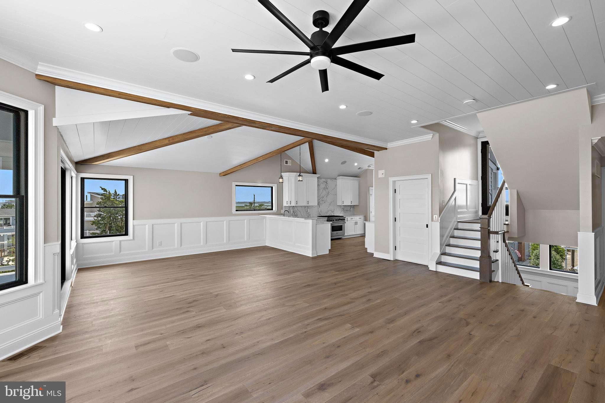17 Butler Road Long Beach Township, NJ 08006 - Photo 15 of 110 a view of empty room with wooden floor and ceiling fan