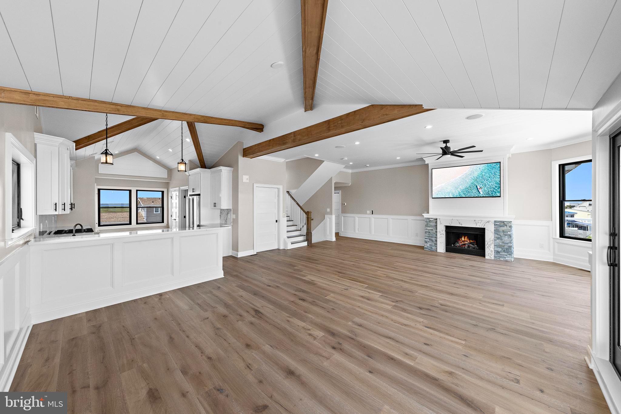 17 Butler Road Long Beach Township, NJ 08006 - Photo 19 of 110 a view of a hallway with wooden floor and a fireplace