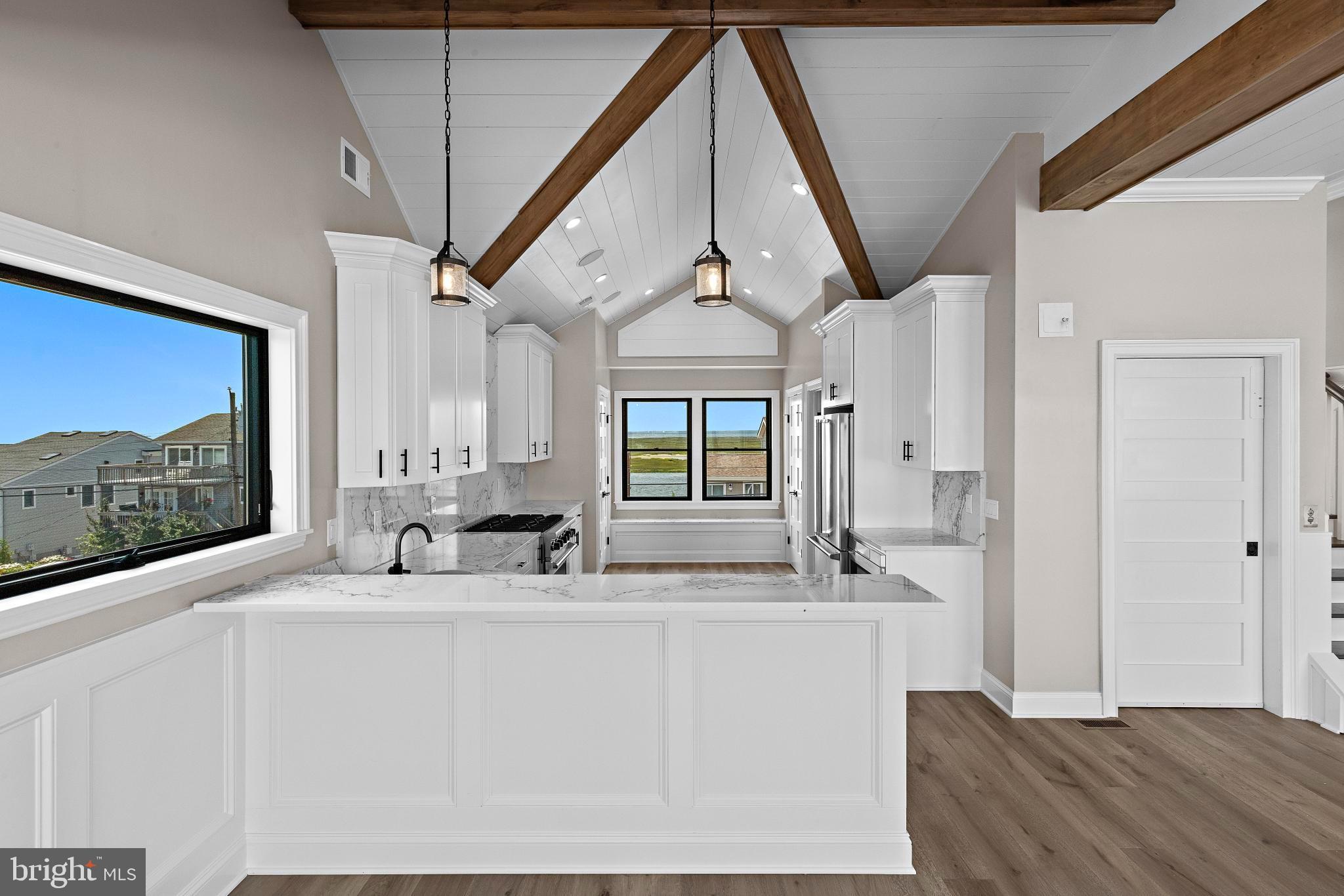 17 Butler Road Long Beach Township, NJ 08006 - Photo 22 of 110 a bathroom with a double vanity sink a mirror and a bathtub