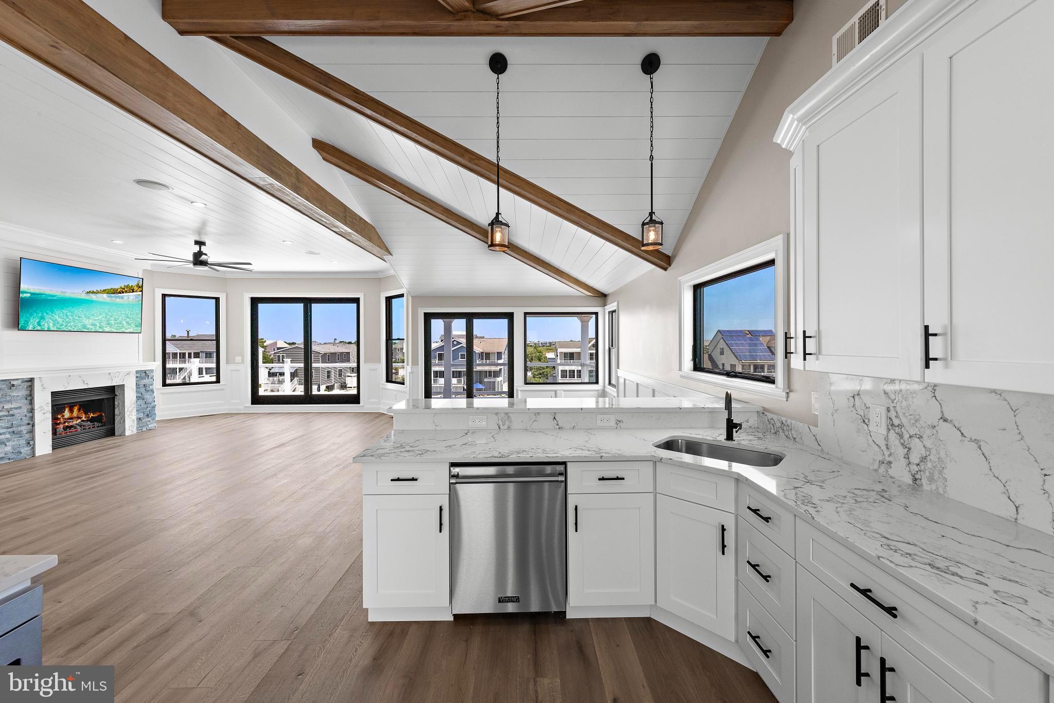 17 Butler Road Long Beach Township, NJ 08006 - Photo 26 of 110 a kitchen with stainless steel appliances granite countertop a stove and cabinets
