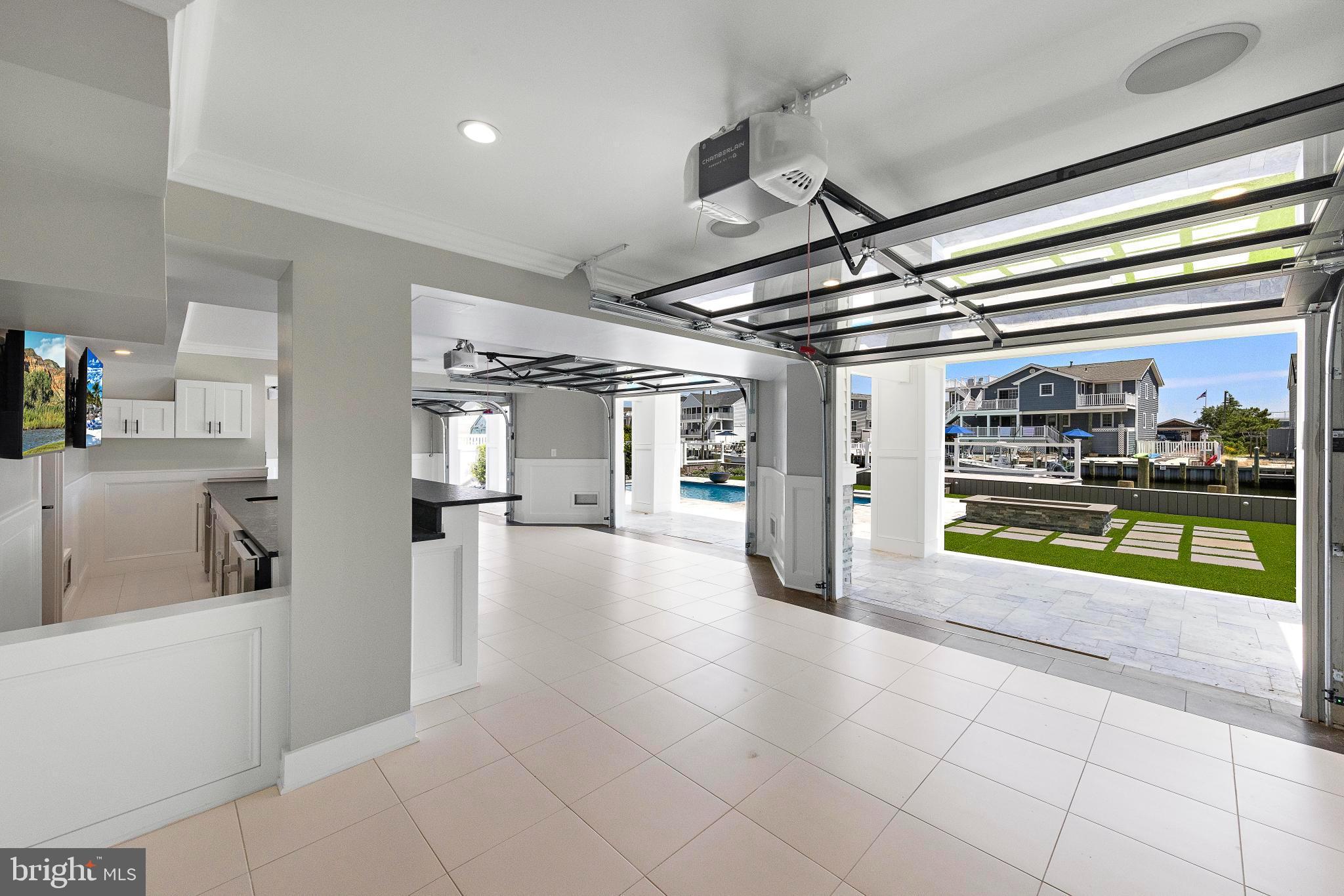 17 Butler Road Long Beach Township, NJ 08006 - Photo 31 of 110 a view of a hallway with a dining table and chairs