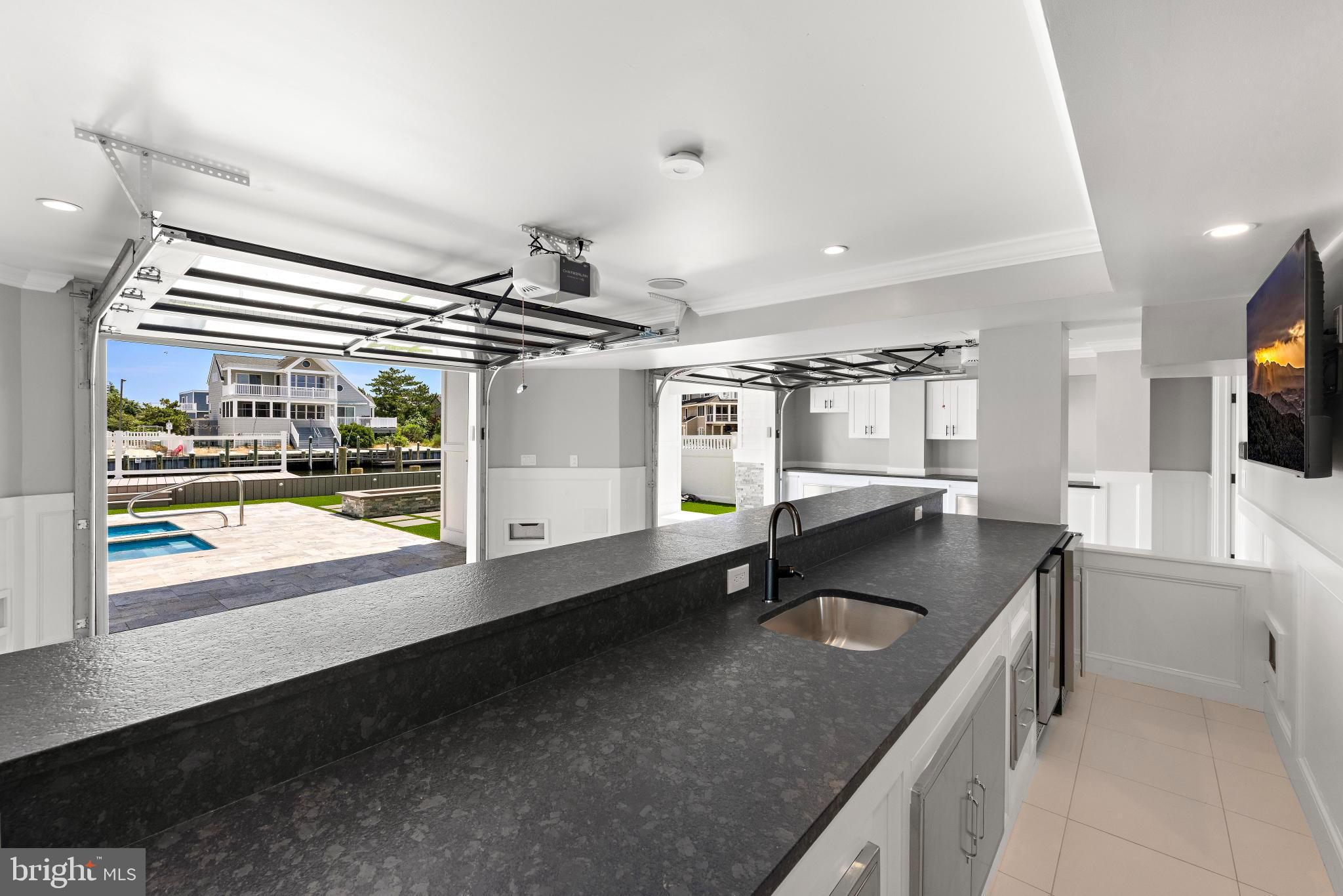 17 Butler Road Long Beach Township, NJ 08006 - Photo 36 of 110 a kitchen with stainless steel appliances granite countertop a sink a stove and a refrigerator