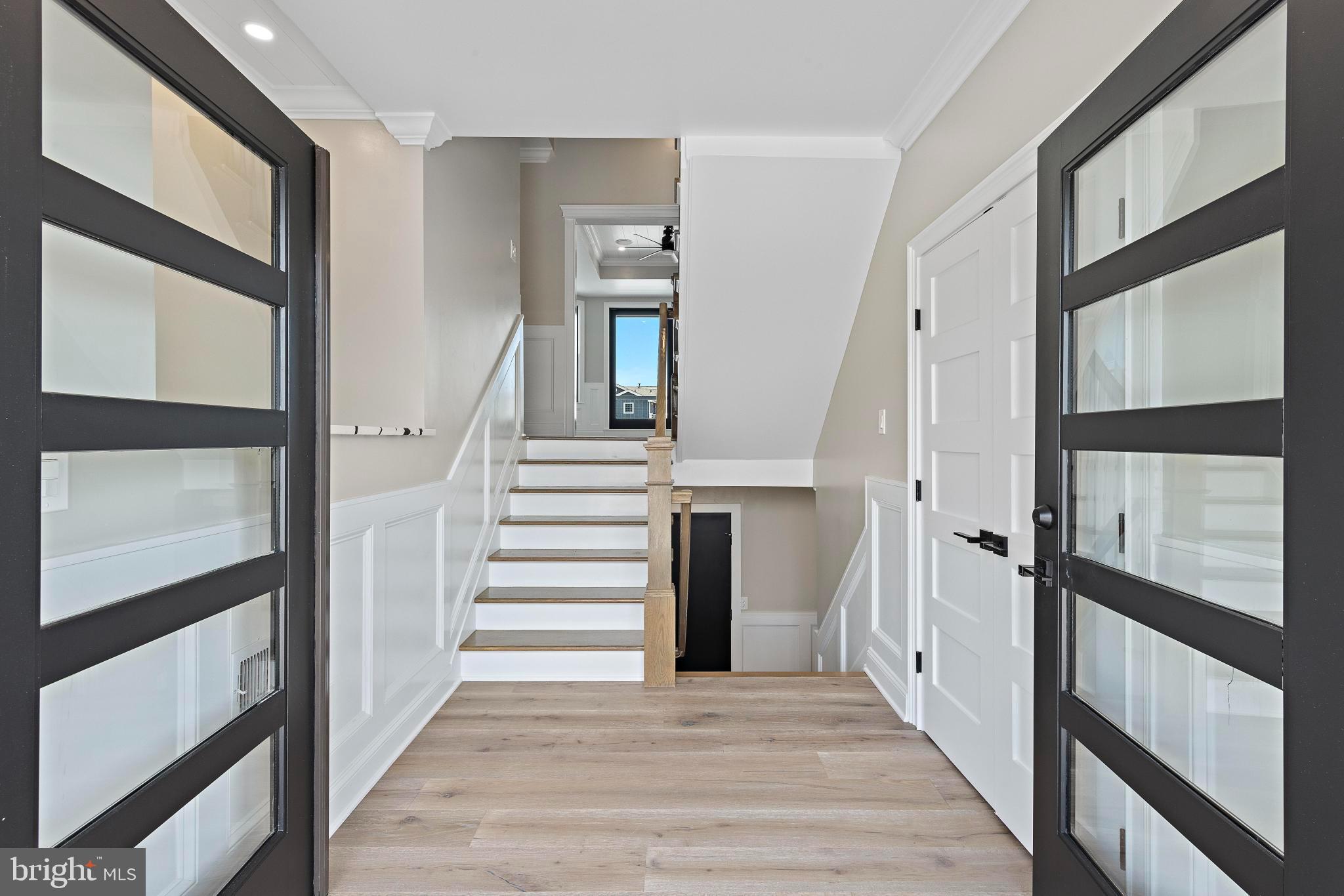 17 Butler Road Long Beach Township, NJ 08006 - Photo 41 of 110 a view of a hallway with wooden floor and windows