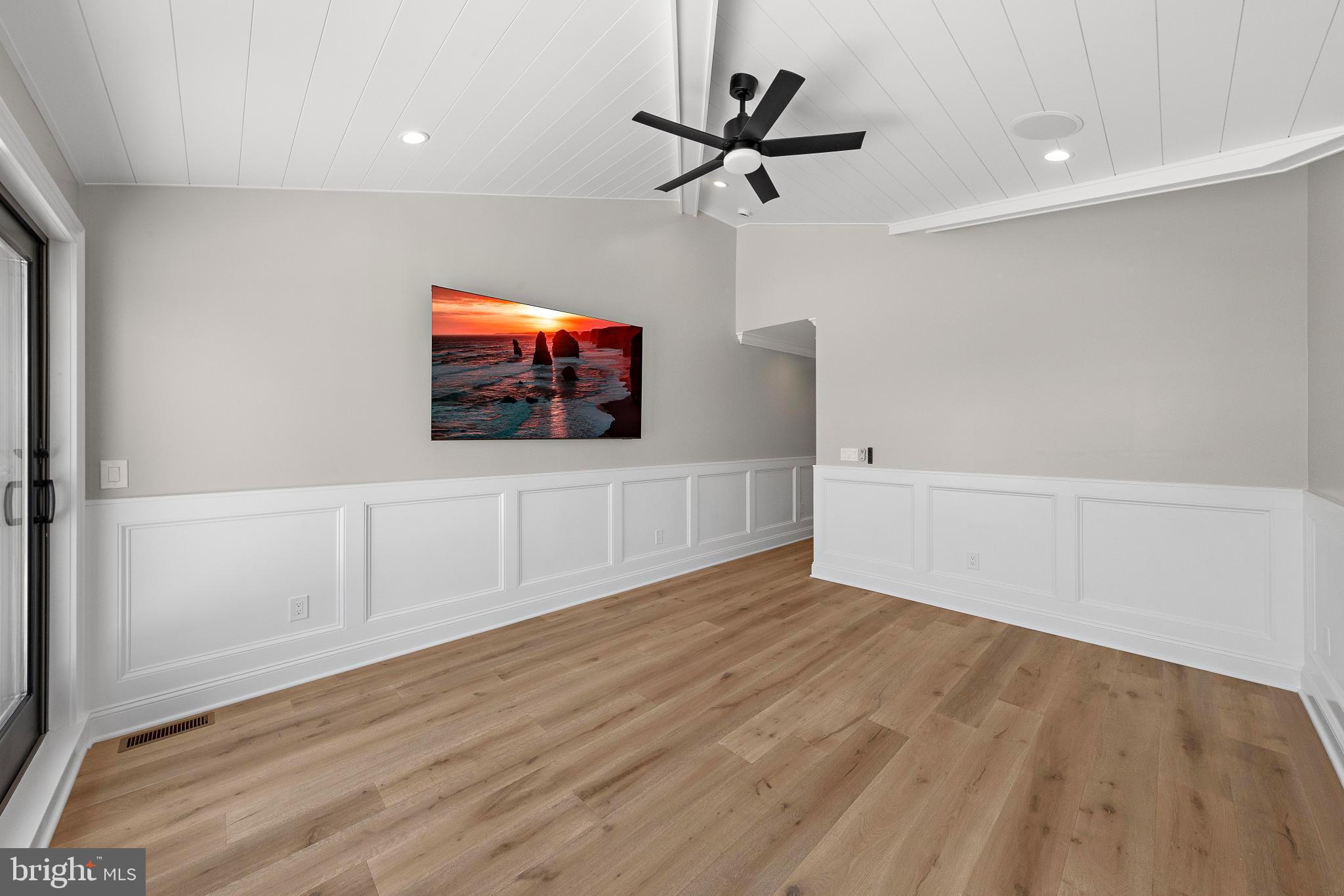 17 Butler Road Long Beach Township, NJ 08006 - Photo 44 of 110 a view of a livingroom with a flat screen tv
