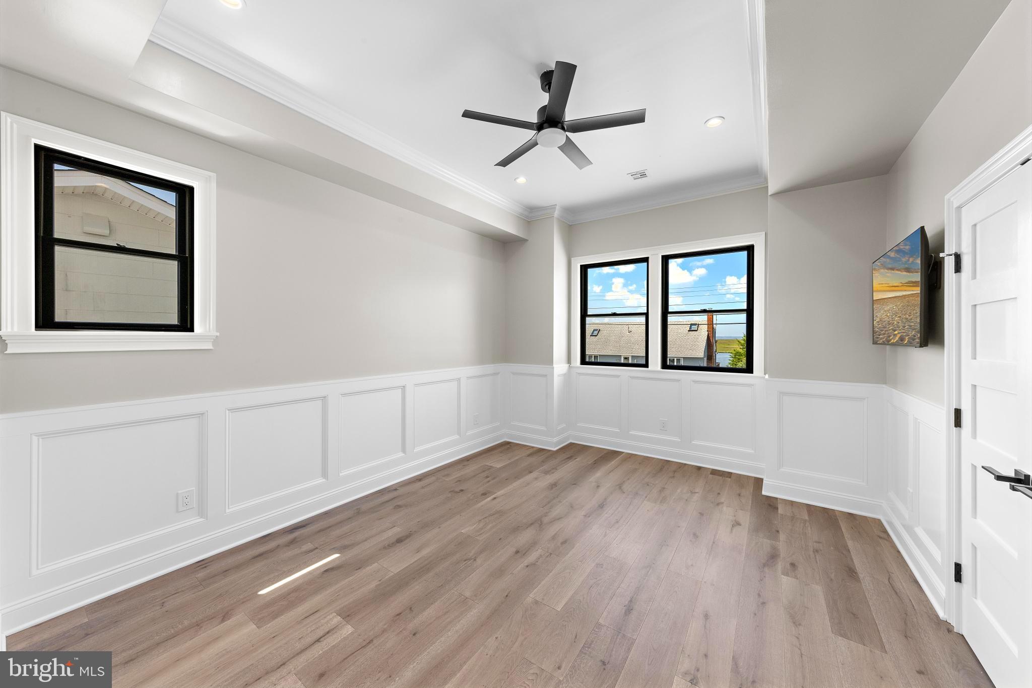 17 Butler Road Long Beach Township, NJ 08006 - Photo 56 of 110 a view of an empty room with a window and wooden floor