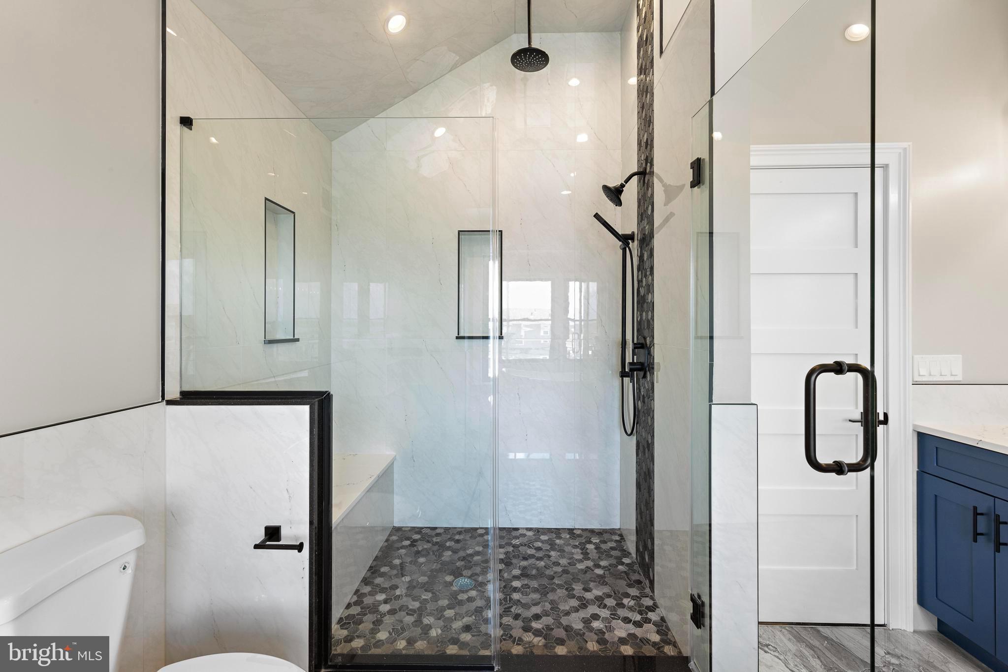 17 Butler Road Long Beach Township, NJ 08006 - Photo 66 of 110 a bathroom with a shower and a mirror