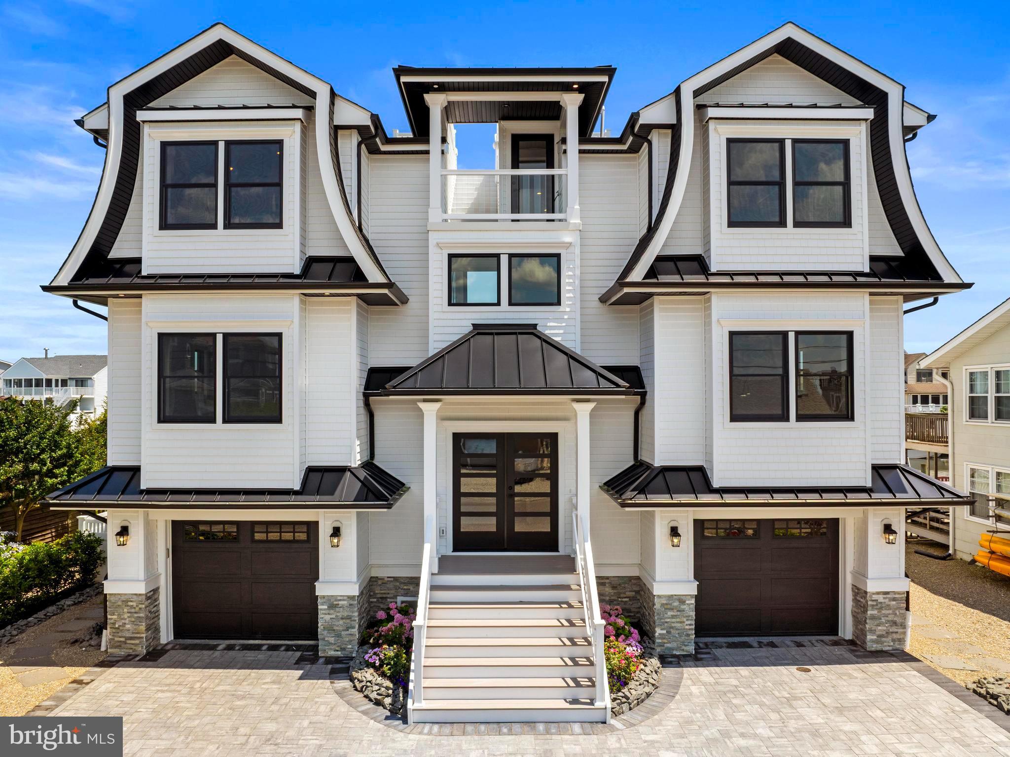 17 Butler Road Long Beach Township, NJ 08006 - Photo 7 of 110 a front view of a house with a door and a fireplace