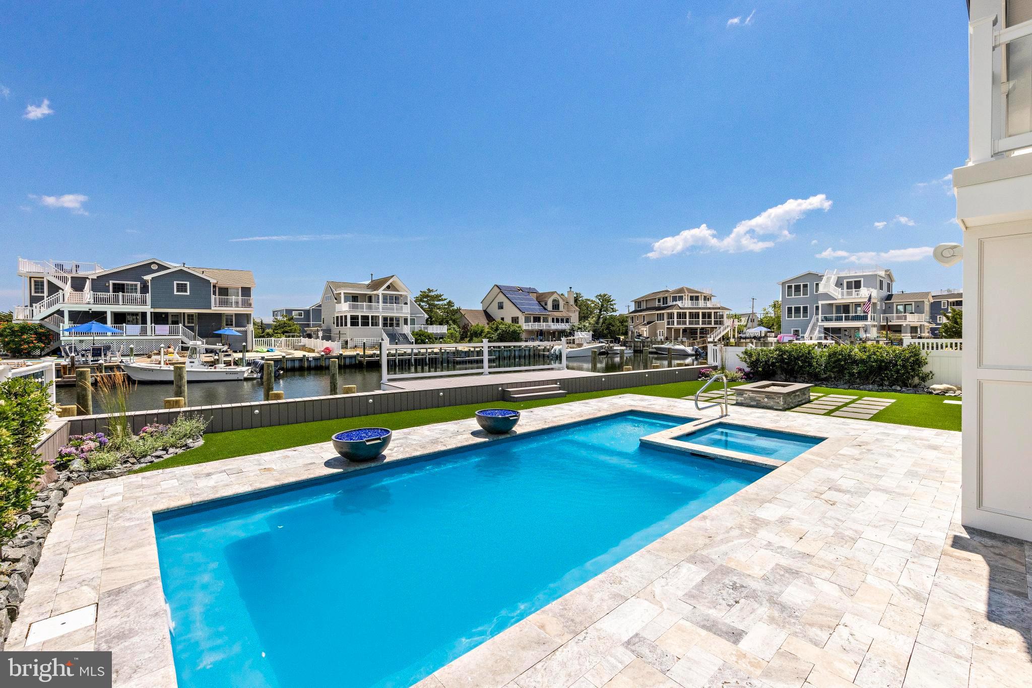 17 Butler Road Long Beach Township, NJ 08006 - Photo 80 of 110 a view of swimming pool with outdoor seating and city view