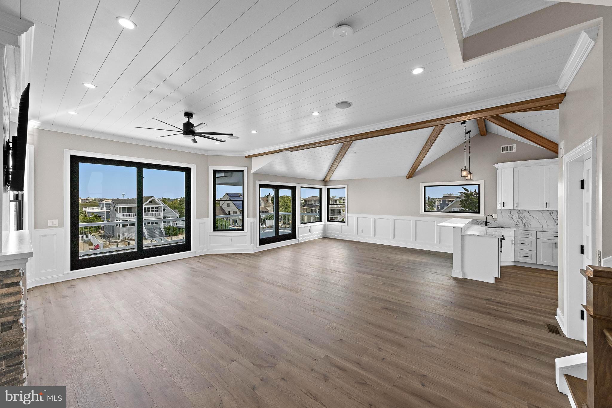 17 Butler Road Long Beach Township, NJ 08006 - Photo 10 of 110 a view of an empty room with wooden floor and a window