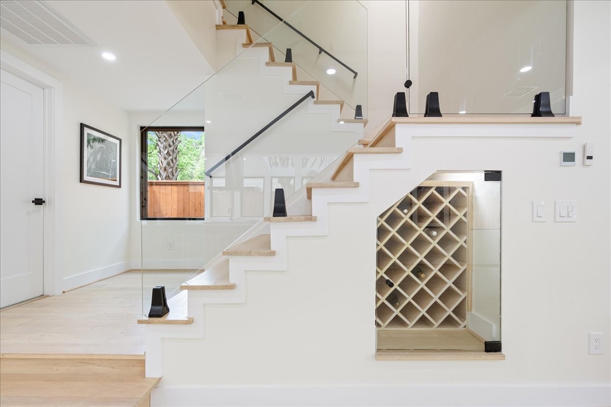 2135 Quenby Street Houston, TX 77005 - Photo 13 of 48 a view of entryway and hall with wooden floor