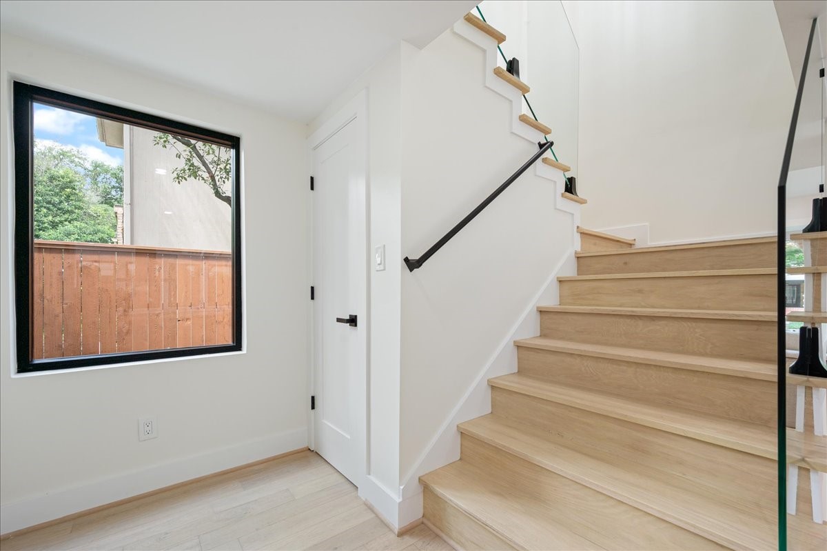 2135 Quenby Street Houston, TX 77005 - Photo 19 of 48 a view of entryway with wooden floor and front door