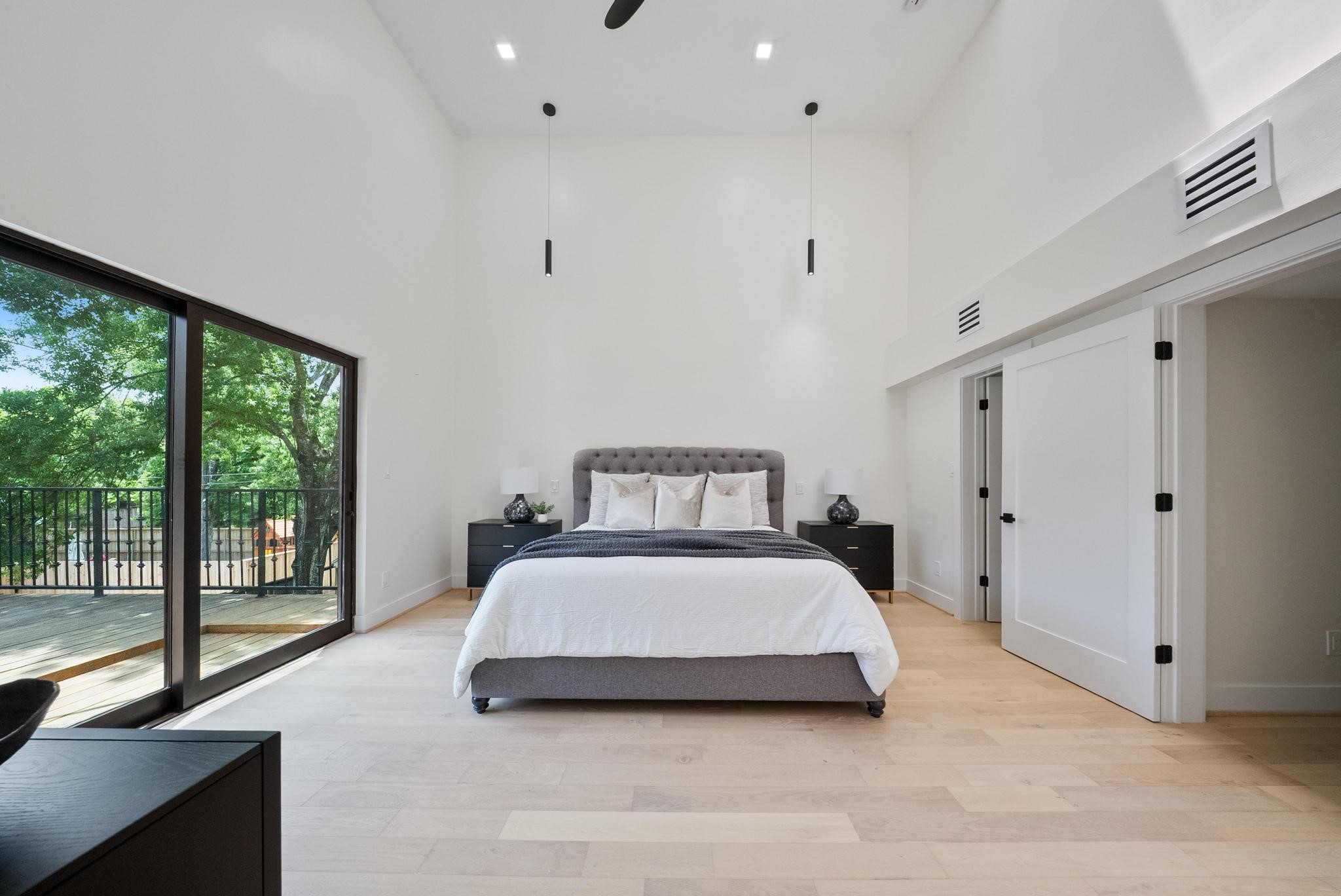 2135 Quenby Street Houston, TX 77005 - Photo 29 of 48 a bedroom with a bed and large window