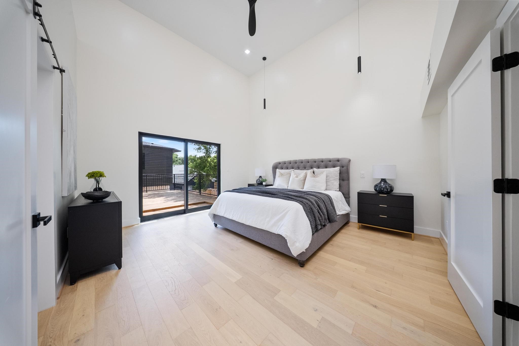 2135 Quenby Street Houston, TX 77005 - Photo 30 of 48 a bedroom with a bed and window