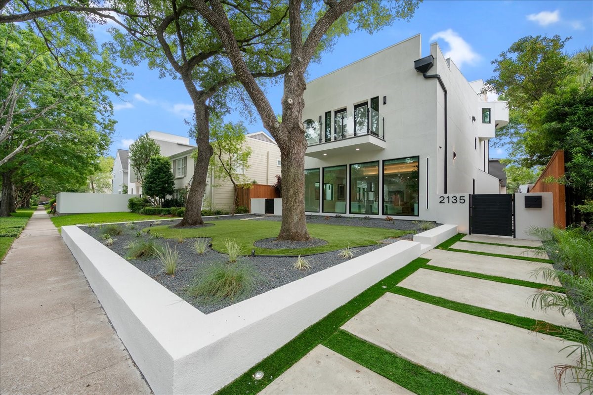 2135 Quenby Street Houston, TX 77005 - Photo 4 of 48 a view of a house with a yard