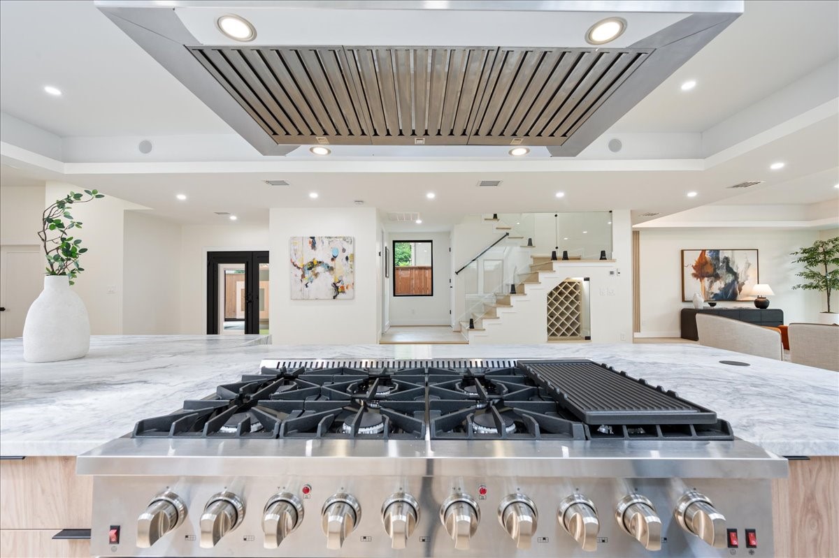 2135 Quenby Street Houston, TX 77005 - Photo 9 of 48 a view of a kitchen with kitchen island stainless steel appliances a sink and cabinets