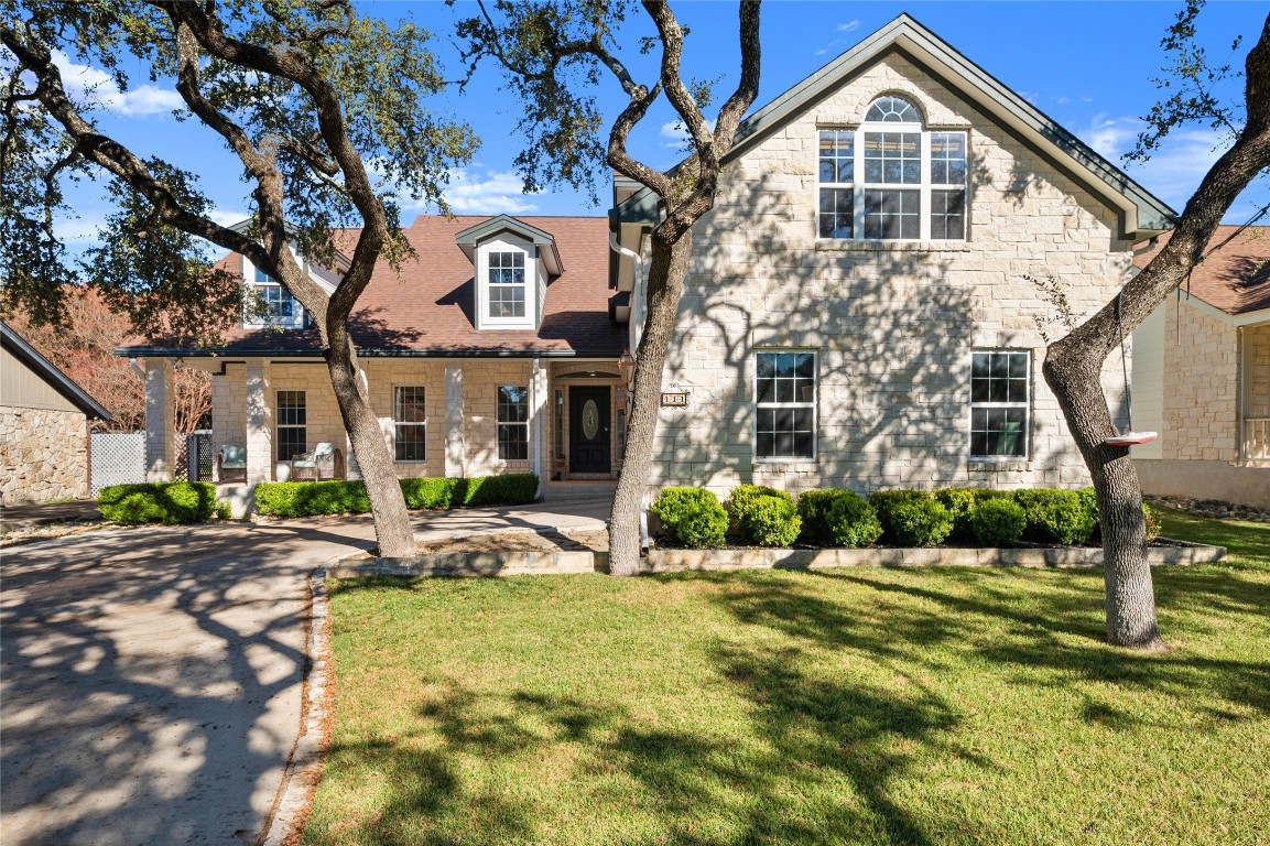 111 Augusta Drive Wimberley, TX 78676 - Photo 1 of 1 a front view of a house with garden