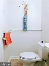 a bathroom with a toilet and a sink
