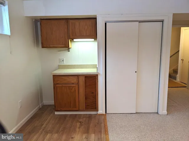 a view of front door with wooden floor
