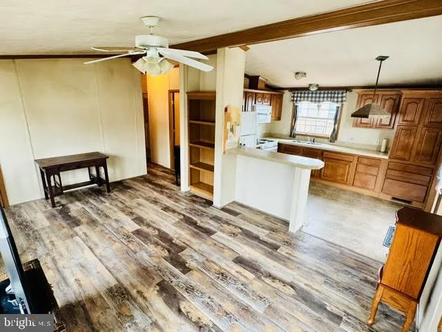 a room with wooden floor and furniture