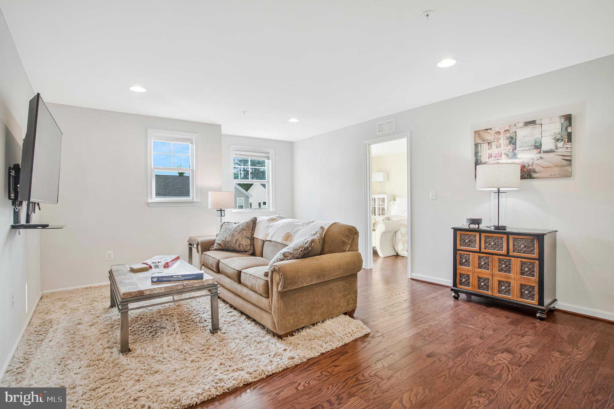 2123 Nottoway Drive Hanover, MD 21076 - Photo 18 of 57 a living room with furniture and a flat screen tv