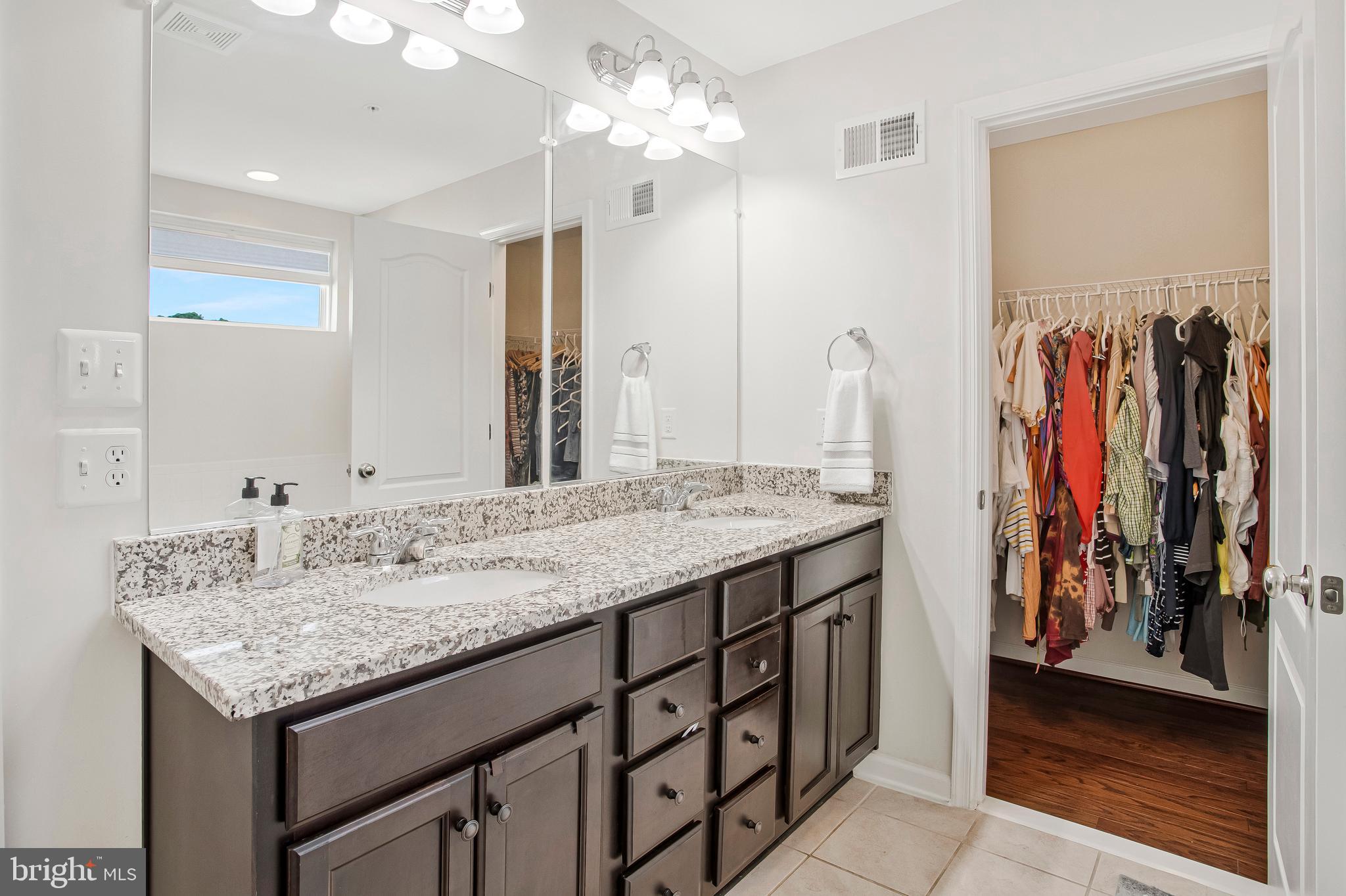 2123 Nottoway Drive Hanover, MD 21076 - Photo 25 of 57 a bathroom with a granite countertop sink and a mirror