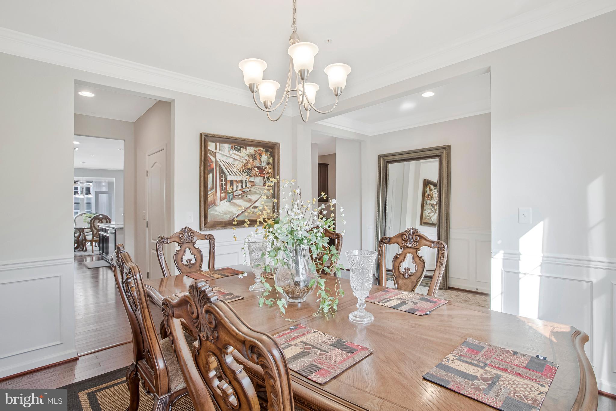 2123 Nottoway Drive Hanover, MD 21076 - Photo 3 of 57 a view of a dining room with furniture a chandelier and wooden floor