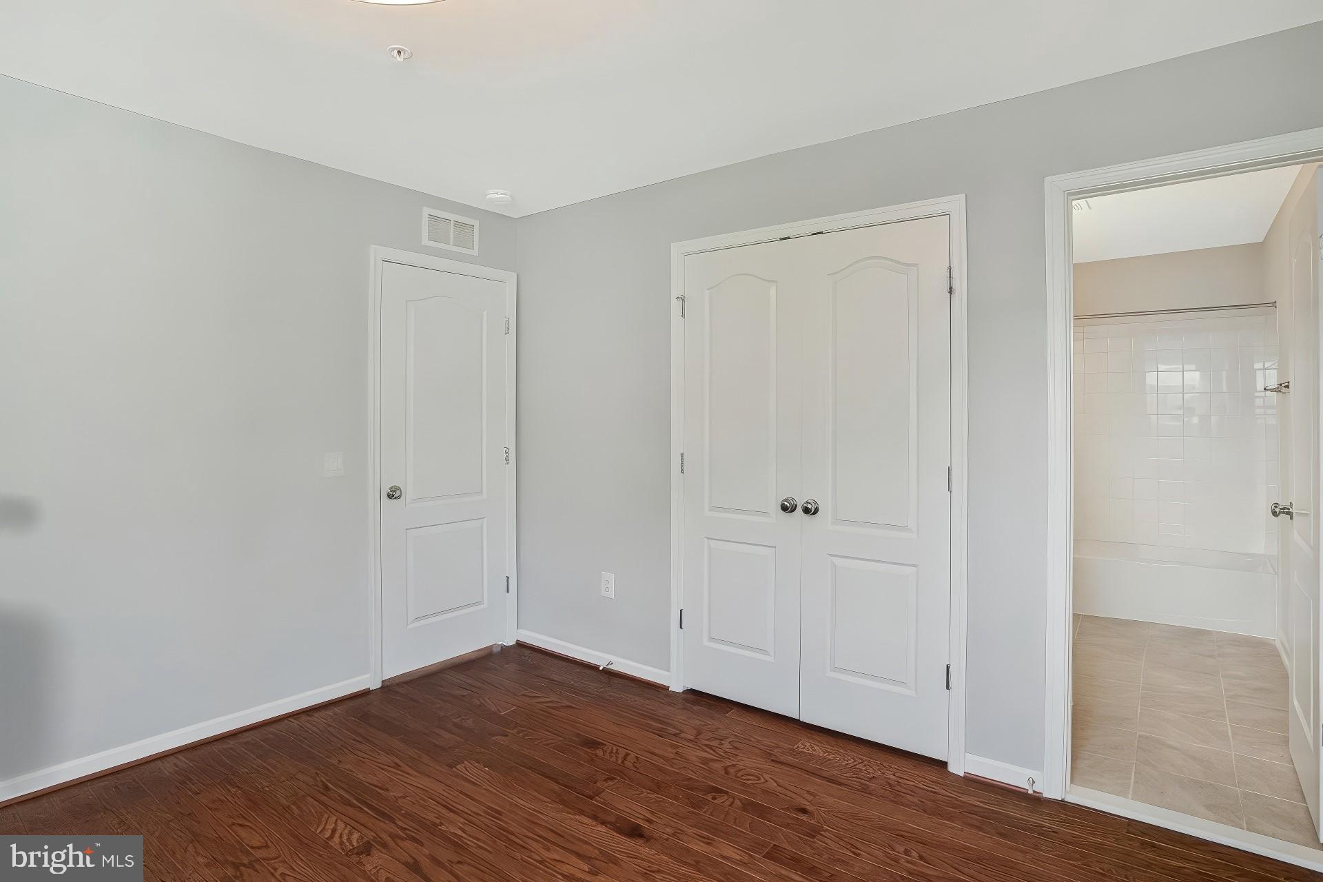 2123 Nottoway Drive Hanover, MD 21076 - Photo 34 of 57 a view of an empty room with wooden floor