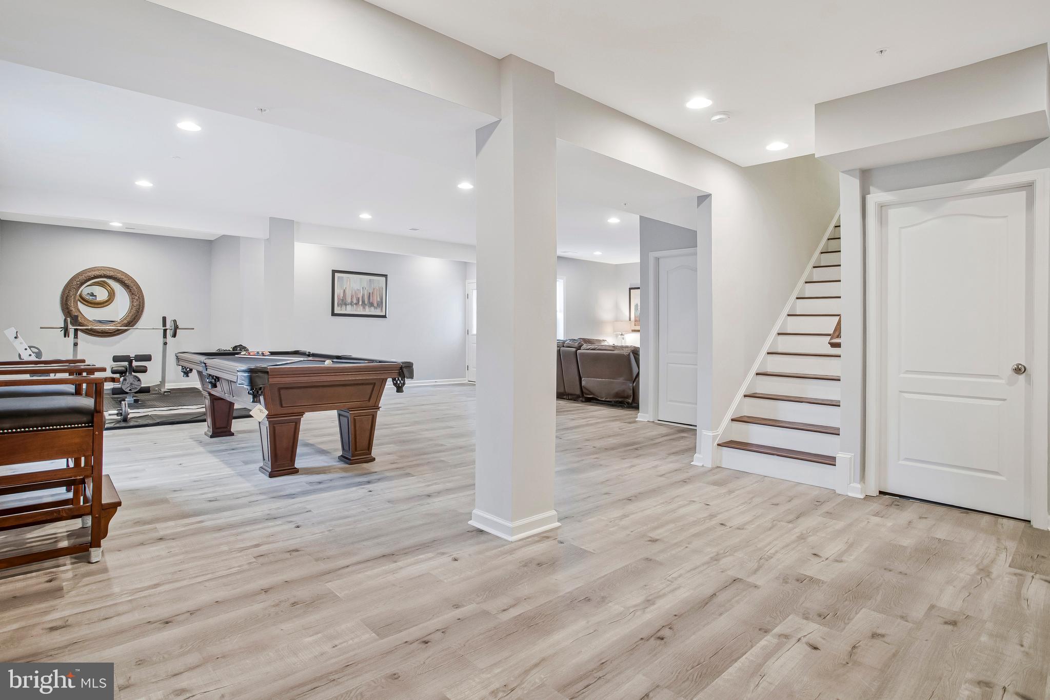 2123 Nottoway Drive Hanover, MD 21076 - Photo 40 of 57 a view of a room with wooden floor and stairs