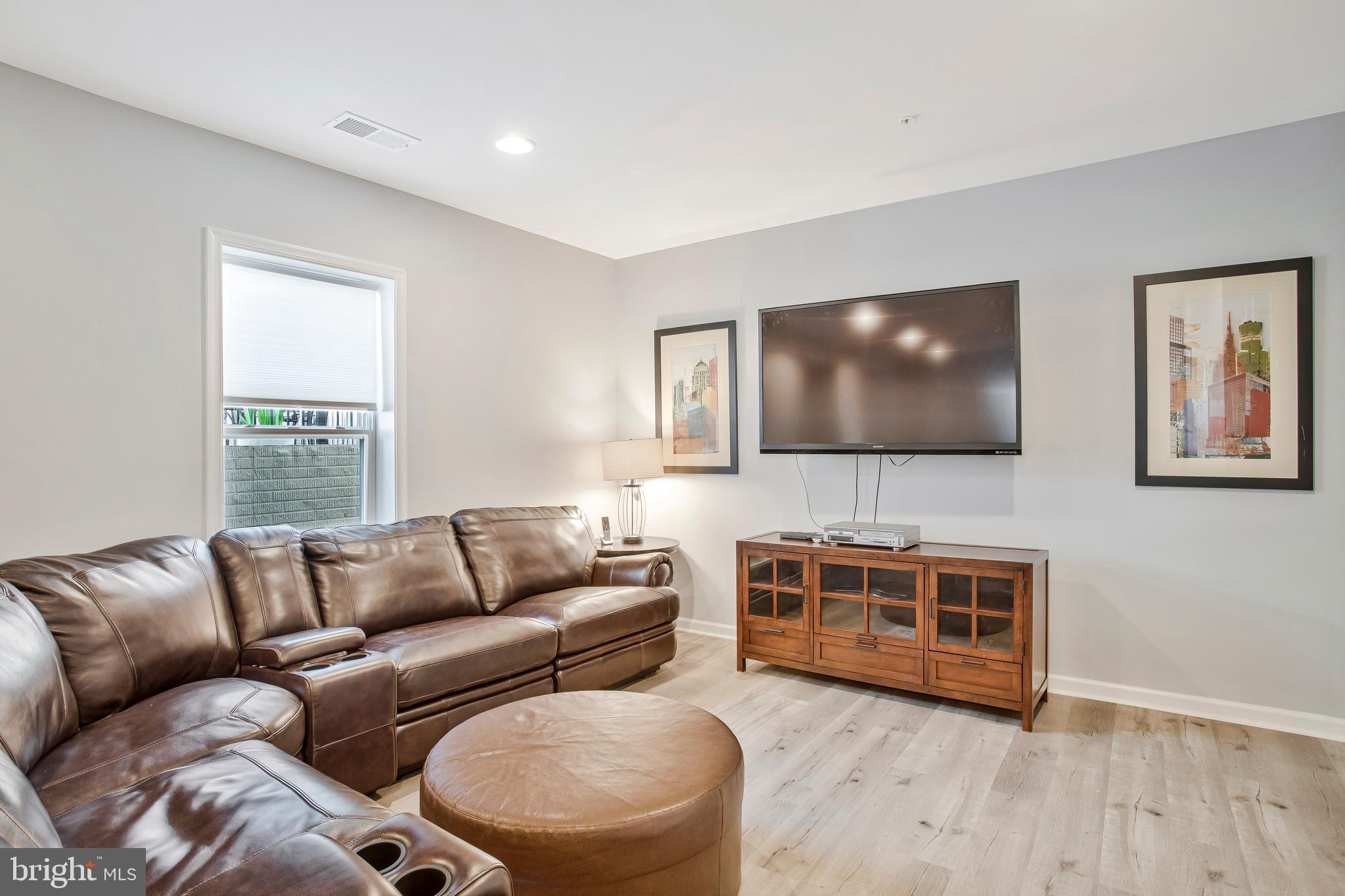 2123 Nottoway Drive Hanover, MD 21076 - Photo 43 of 57 a living room with furniture and a flat screen tv