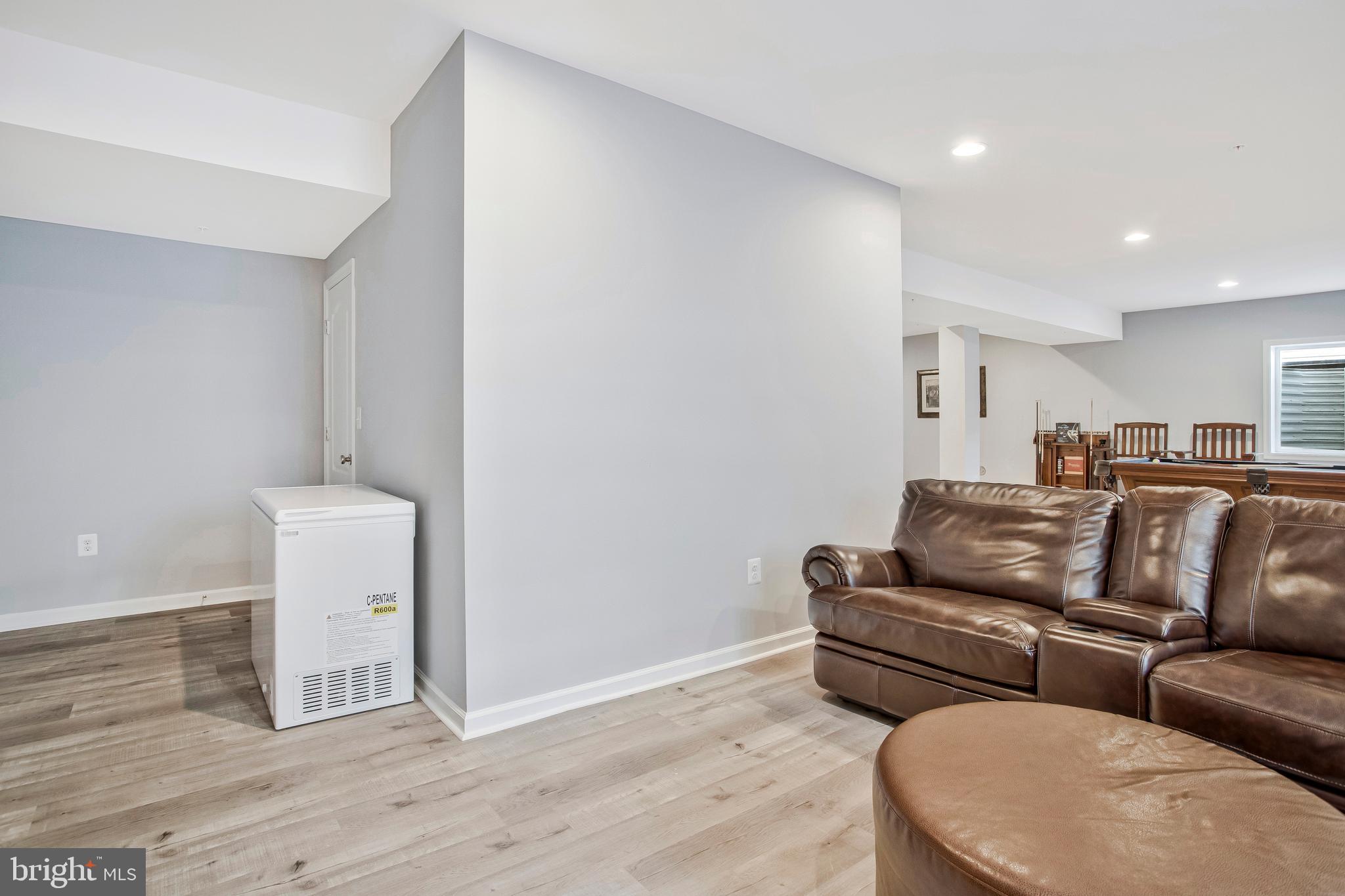 2123 Nottoway Drive Hanover, MD 21076 - Photo 45 of 57 a living room with furniture and a wooden floor