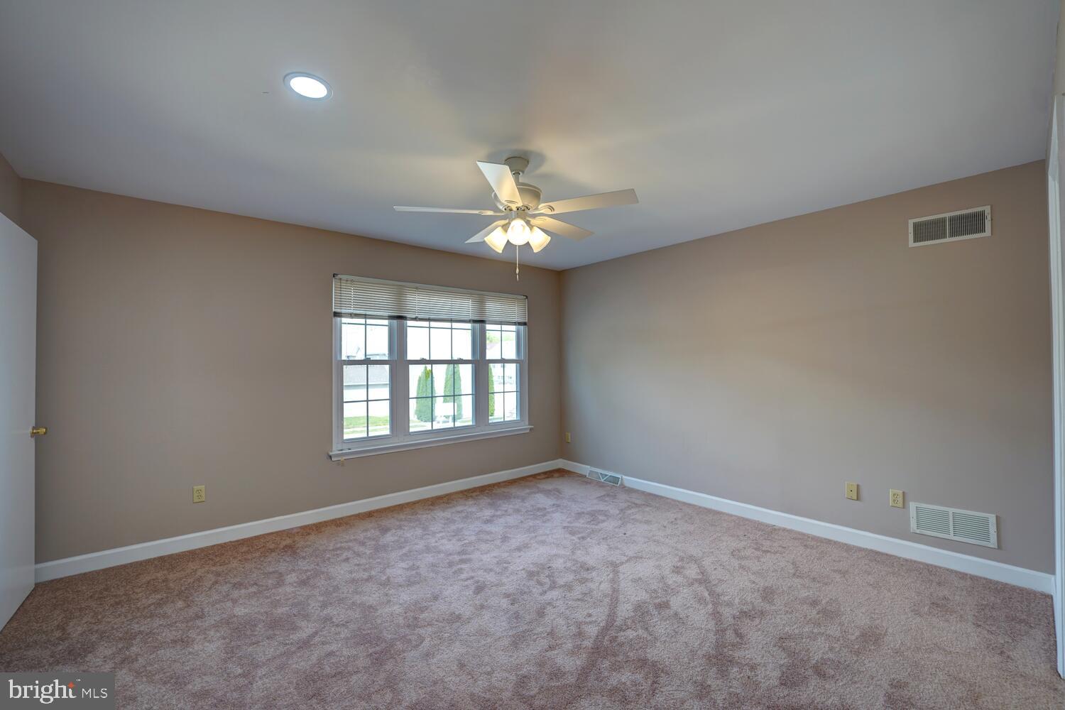 121 Periwinkle Drive Dover, DE 19904 - Photo 19 of 35 a view of an empty room with a window