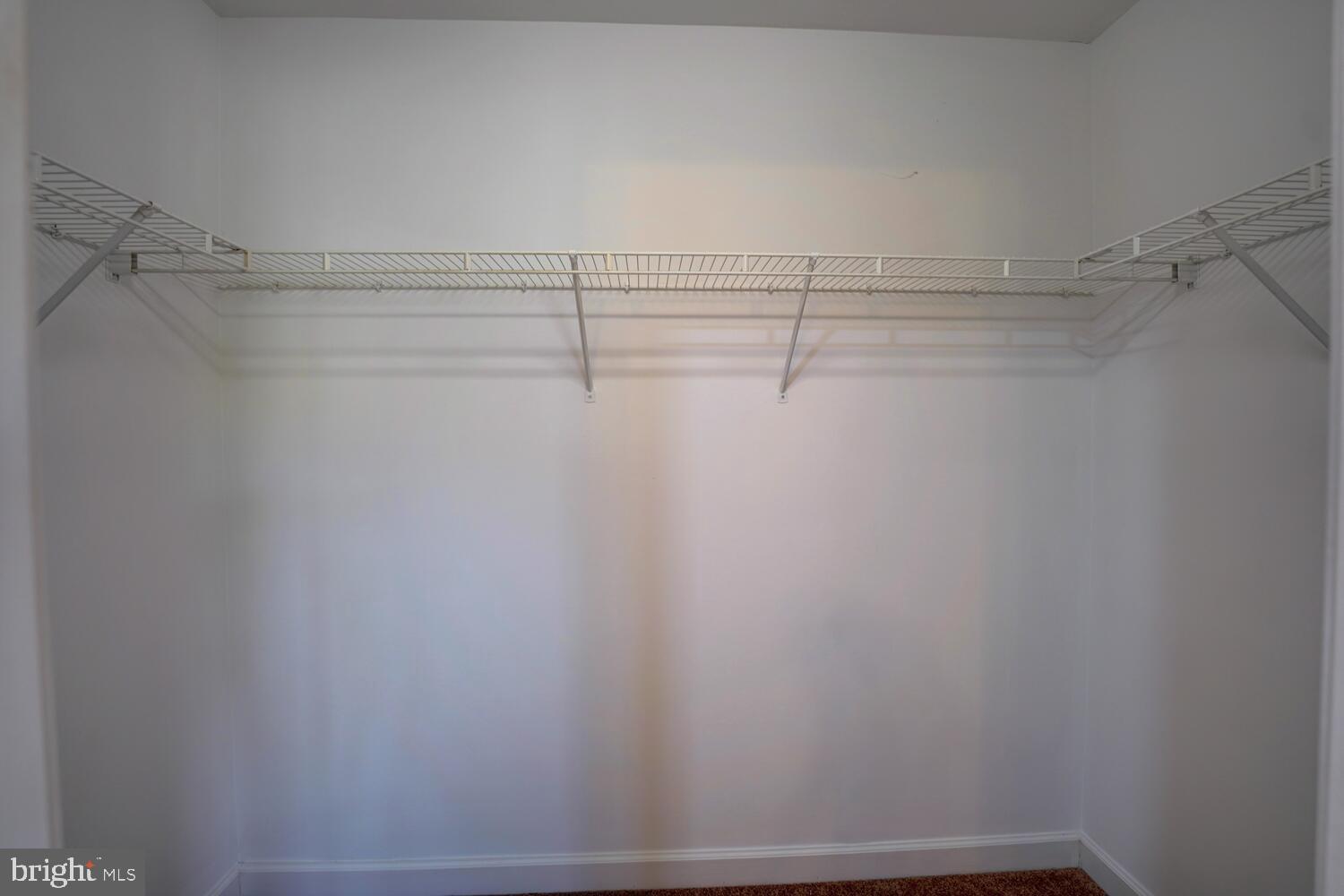 121 Periwinkle Drive Dover, DE 19904 - Photo 23 of 35 a view of a room with racks on the wall