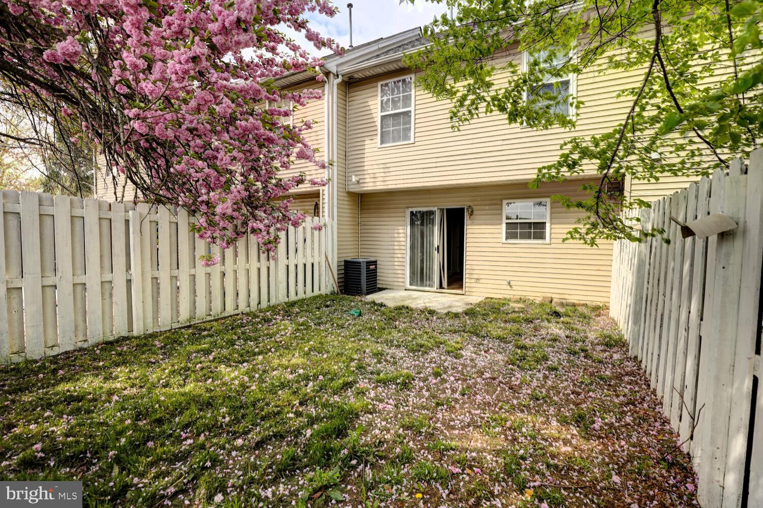 121 Periwinkle Drive Dover, DE 19904 - Photo 33 of 35 a view of a house with a small yard and wooden fence