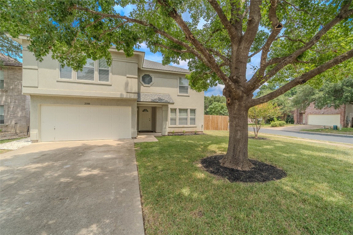 2000 Elk Ridge Cove Round Rock, TX 78665 - Photo 1 of 27 a front view of a house with a yard