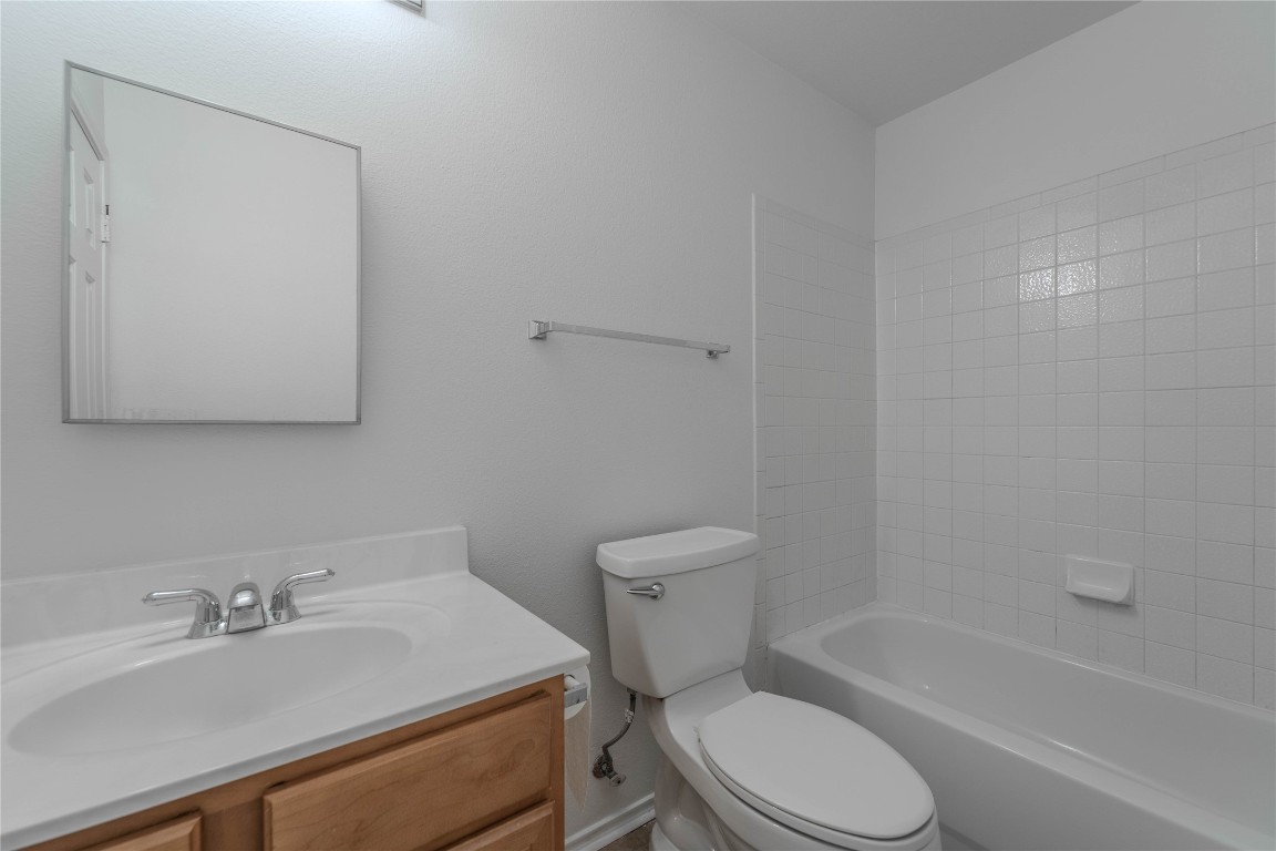2000 Elk Ridge Cove Round Rock, TX 78665 - Photo 22 of 27 a bathroom with a sink toilet vanity and tub