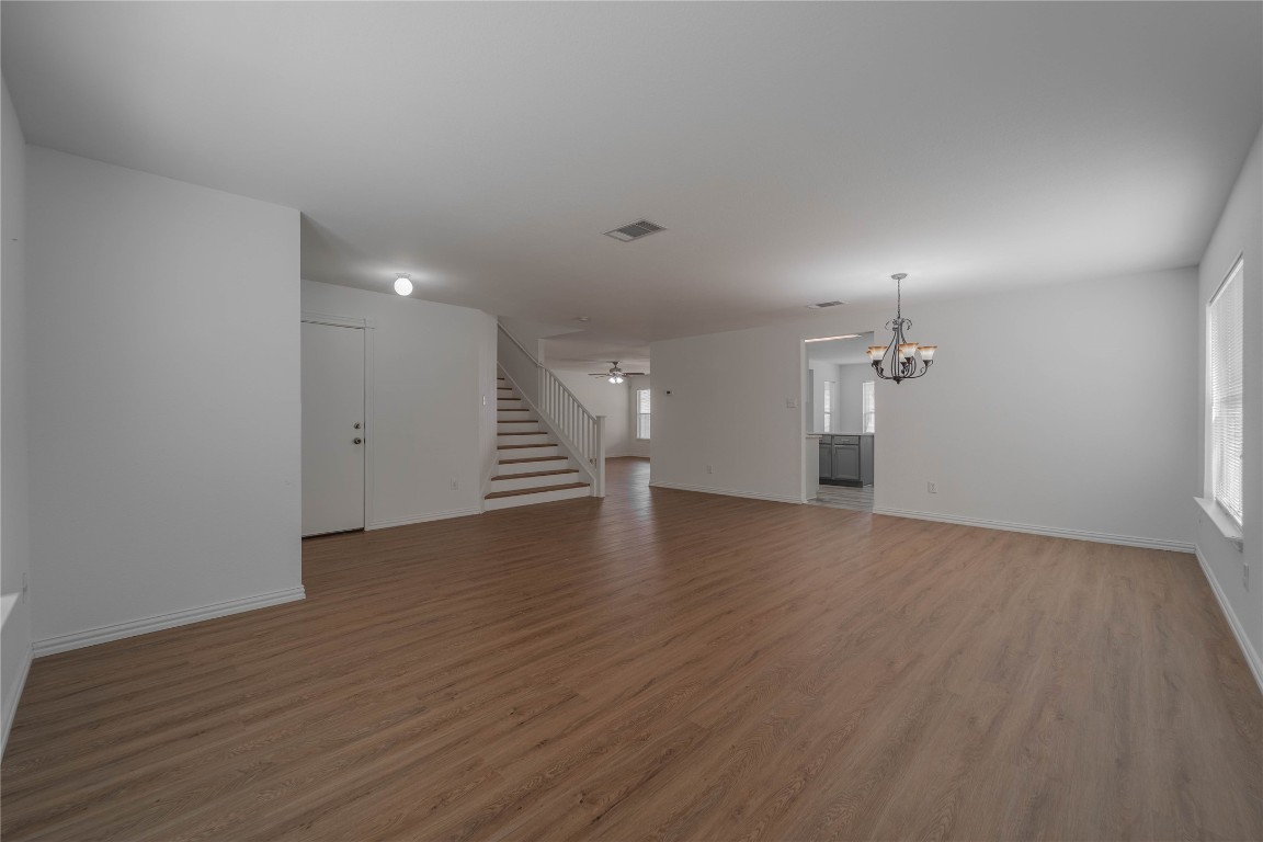 2000 Elk Ridge Cove Round Rock, TX 78665 - Photo 4 of 27 an empty room with wooden floor and windows