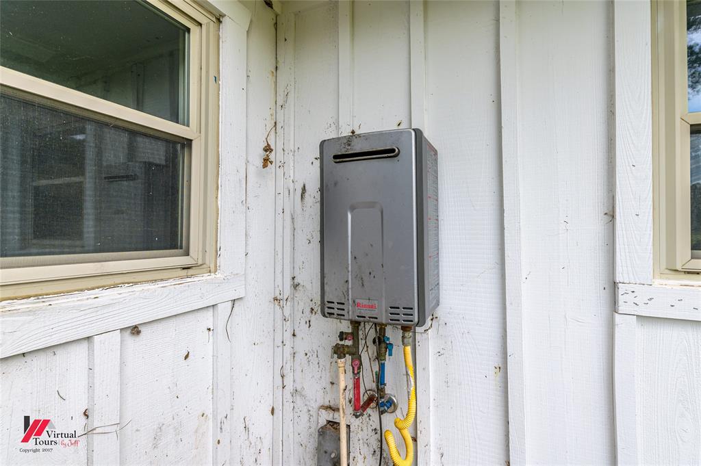 1177 Princeton Road Princeton, LA 71067 - Photo 23 of 34 Tankless water heater! Underneath is the aerator for the Clearwater septic tank.